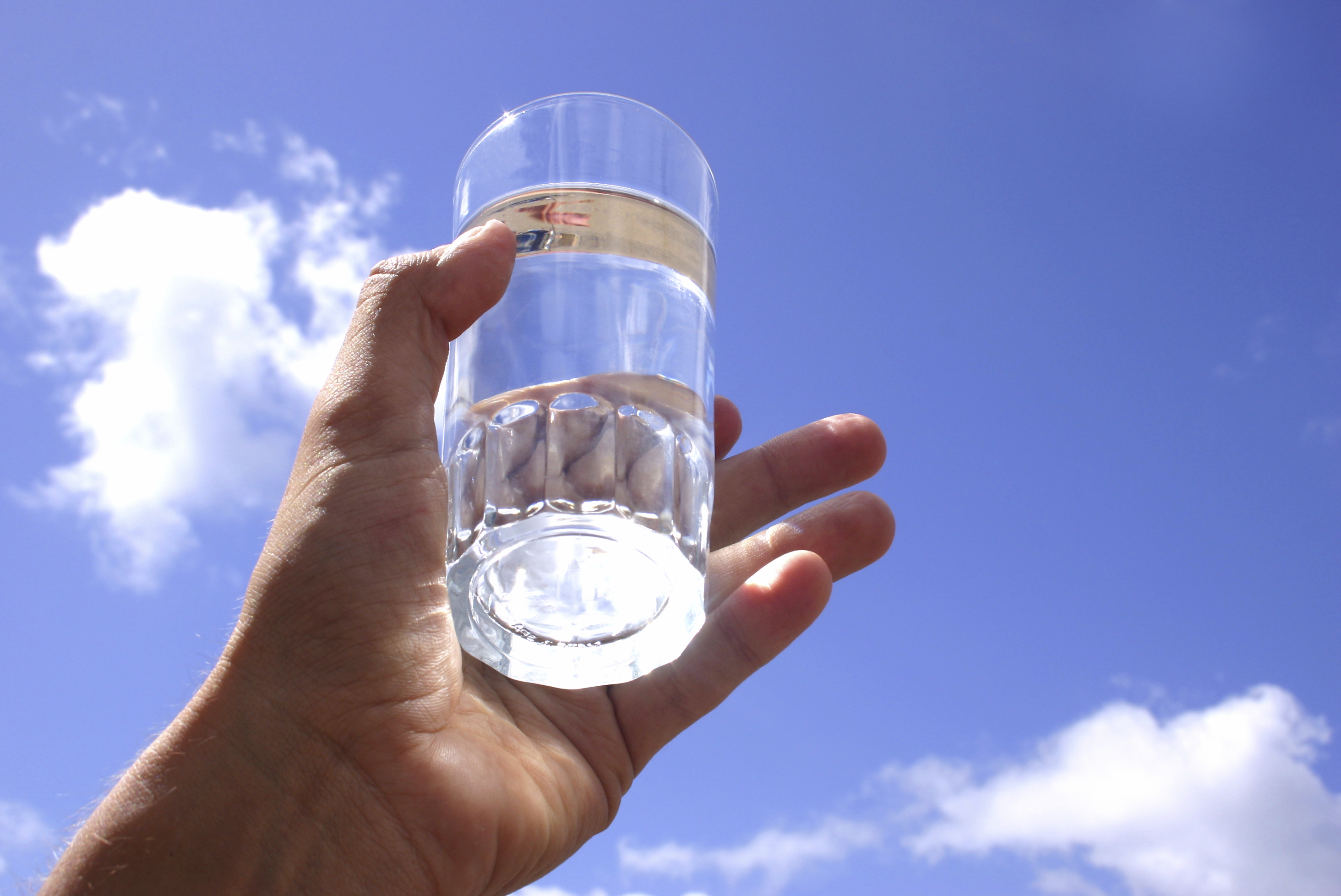 Image of a glass of water being held in the air